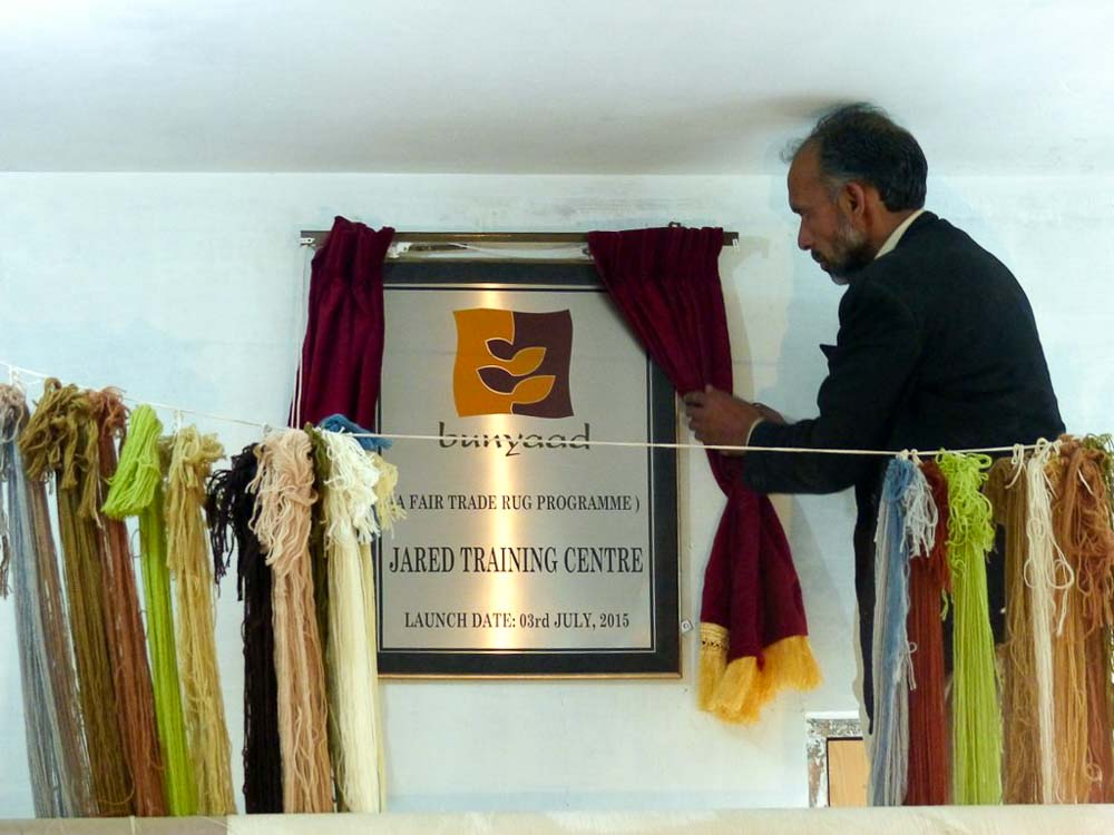 Haleem unveiling the Bunyaad Training Center plaque.